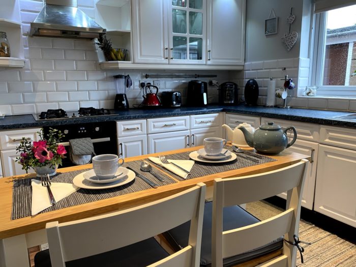 Kitchen and sitting table in a home stay hosts family home