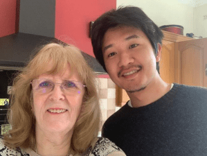 Japanese student taking a selfie with his host mom