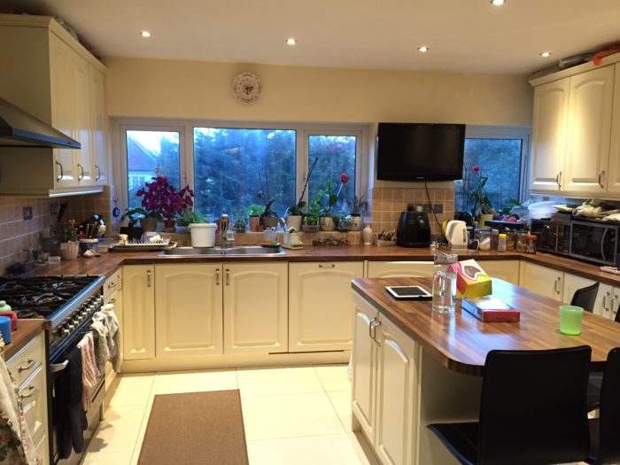 Kitchen with island in a home stay host accommodation